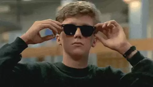 Teah Yeah Adjusts Sunglasses